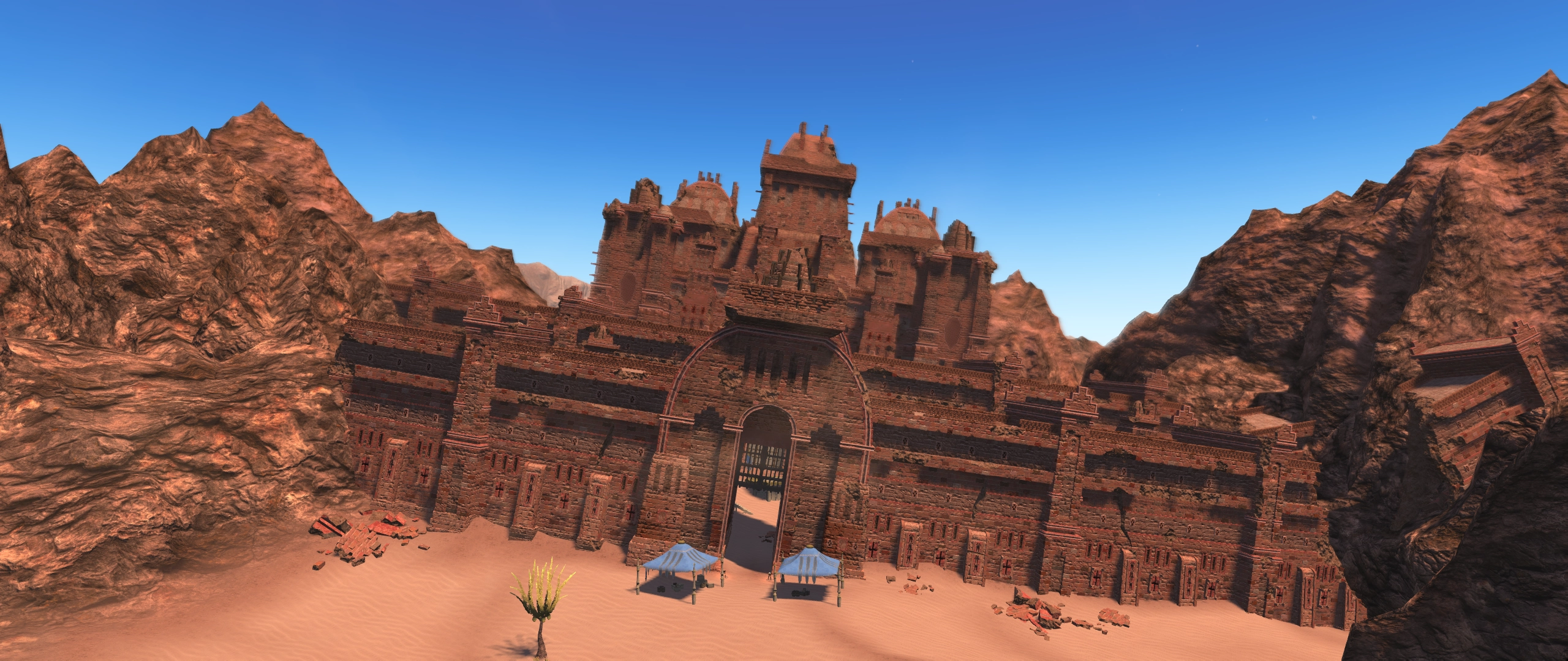 An angled ruined castle out in a desert.